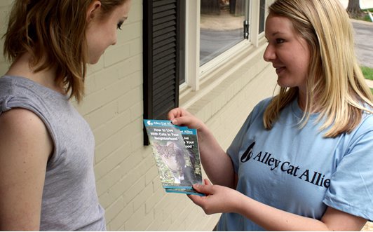 Kayla is going door to door with Alley Cat Allies brochures to help create change in her community.