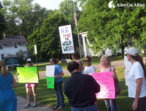 Local advocates rally outside at the North Ridgeville Council Meeting.
