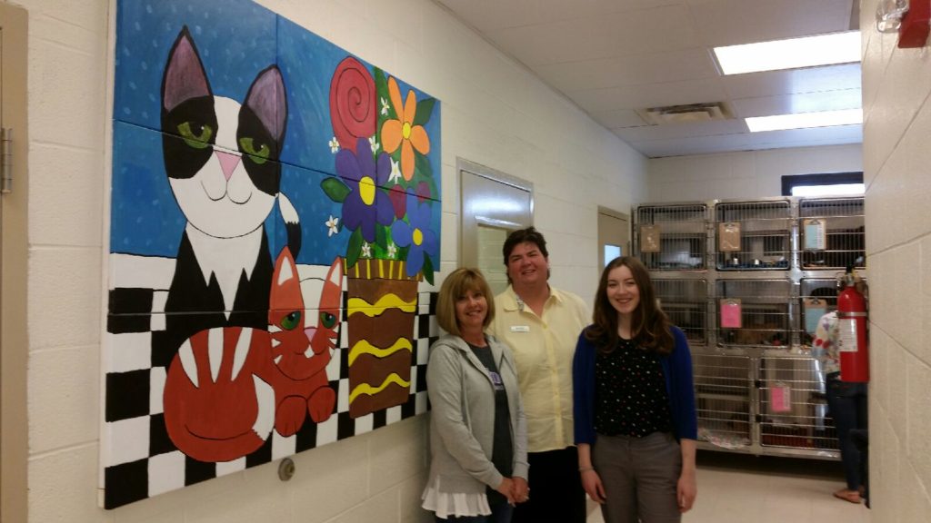 HSWC Executive Director Lavenda Denney gives Alley Cat Allies staff members Alice Burton and Diana Cruz a tour